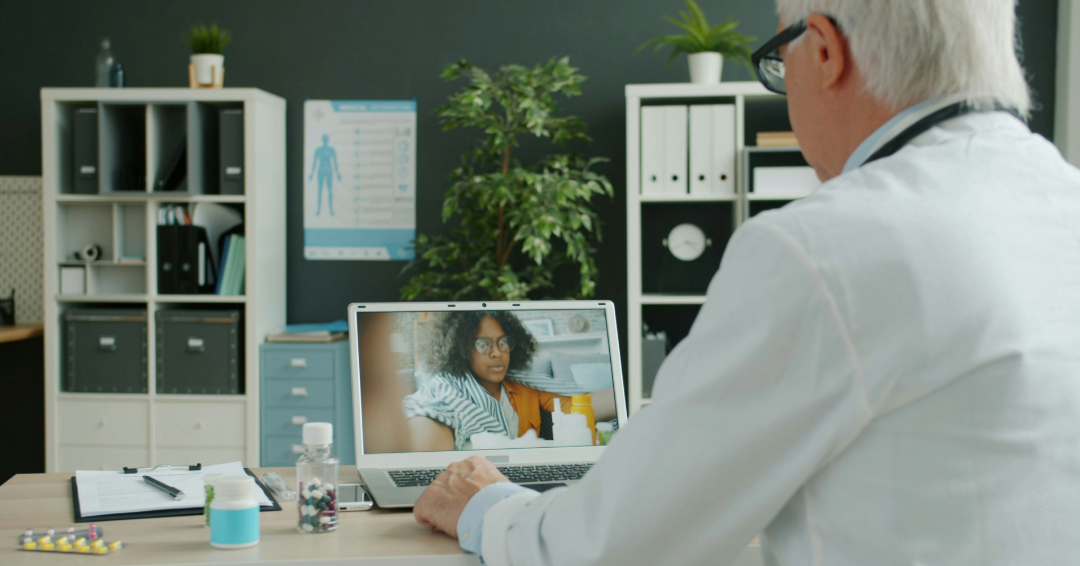 Healthcare Provider on a web consult Photo Source // Unsplash: Vitaly Gariev