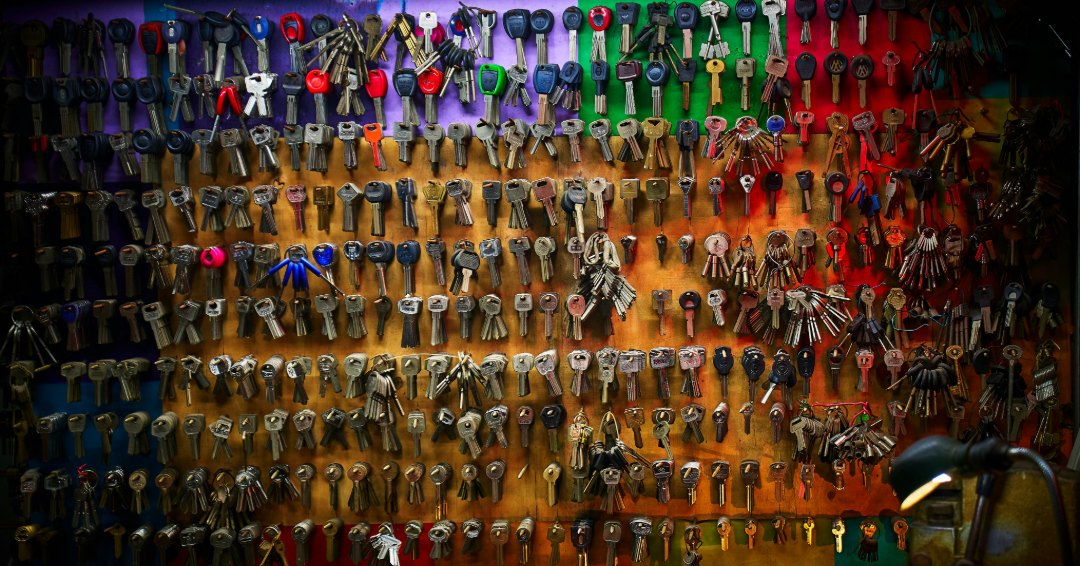 Keys hanging on the wall, against a bright background Photo Source // Unsplash: Chunli Ju