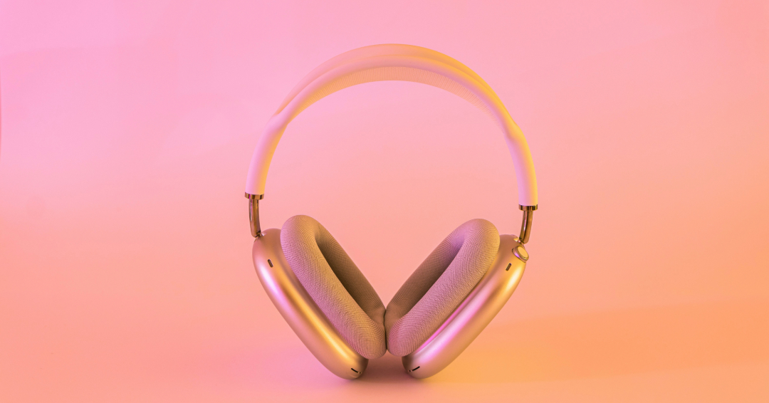 Headphones on a pink gradient support soft skills Photo Source // Unsplash: Evro Rocks